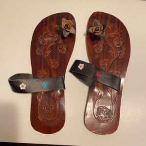 Sandals with cute flower between the toes and flowers on band. Approximately 7.5